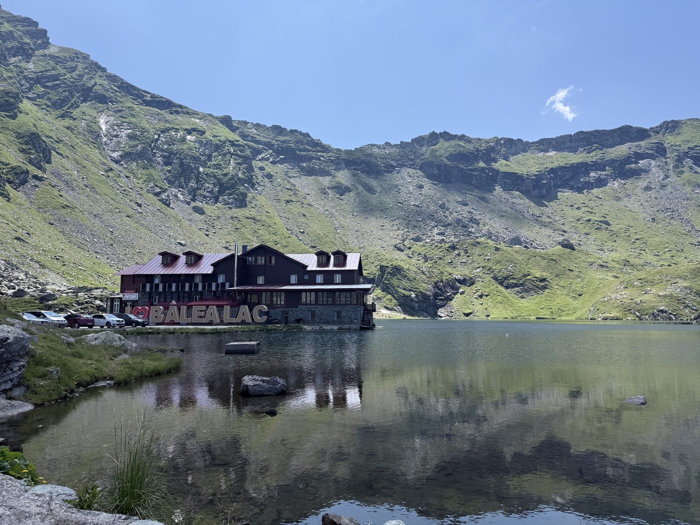The Bâlea Lac chalet reflected in the glacial lake
