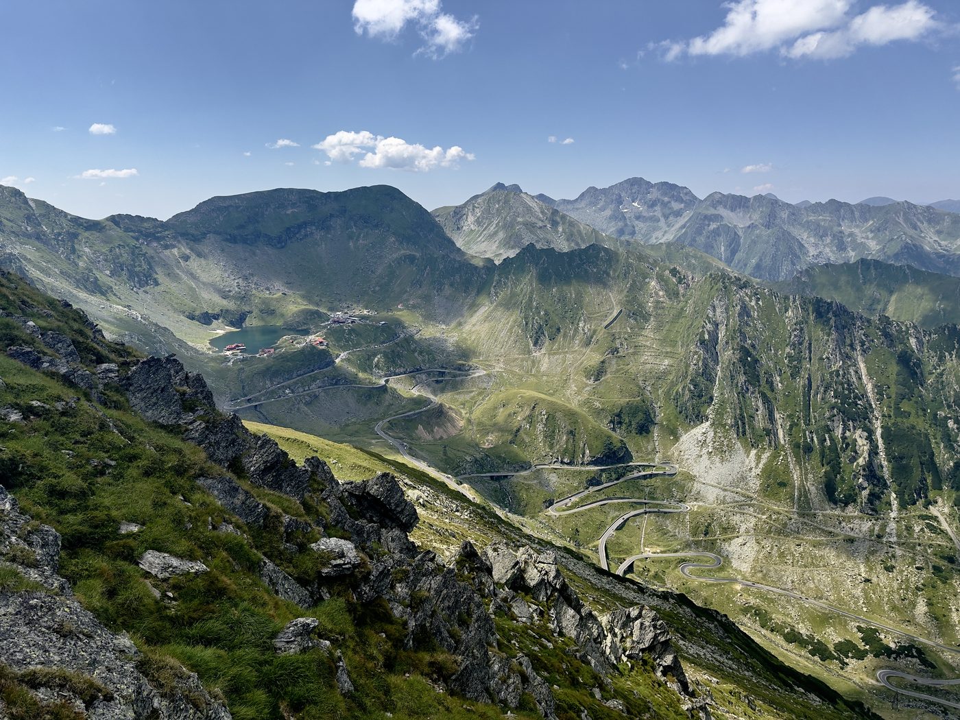 The Făgăraș ridge seen from 2,326 m, with Bâlea Lac and the top hairpins of the Transfăgărășan far below