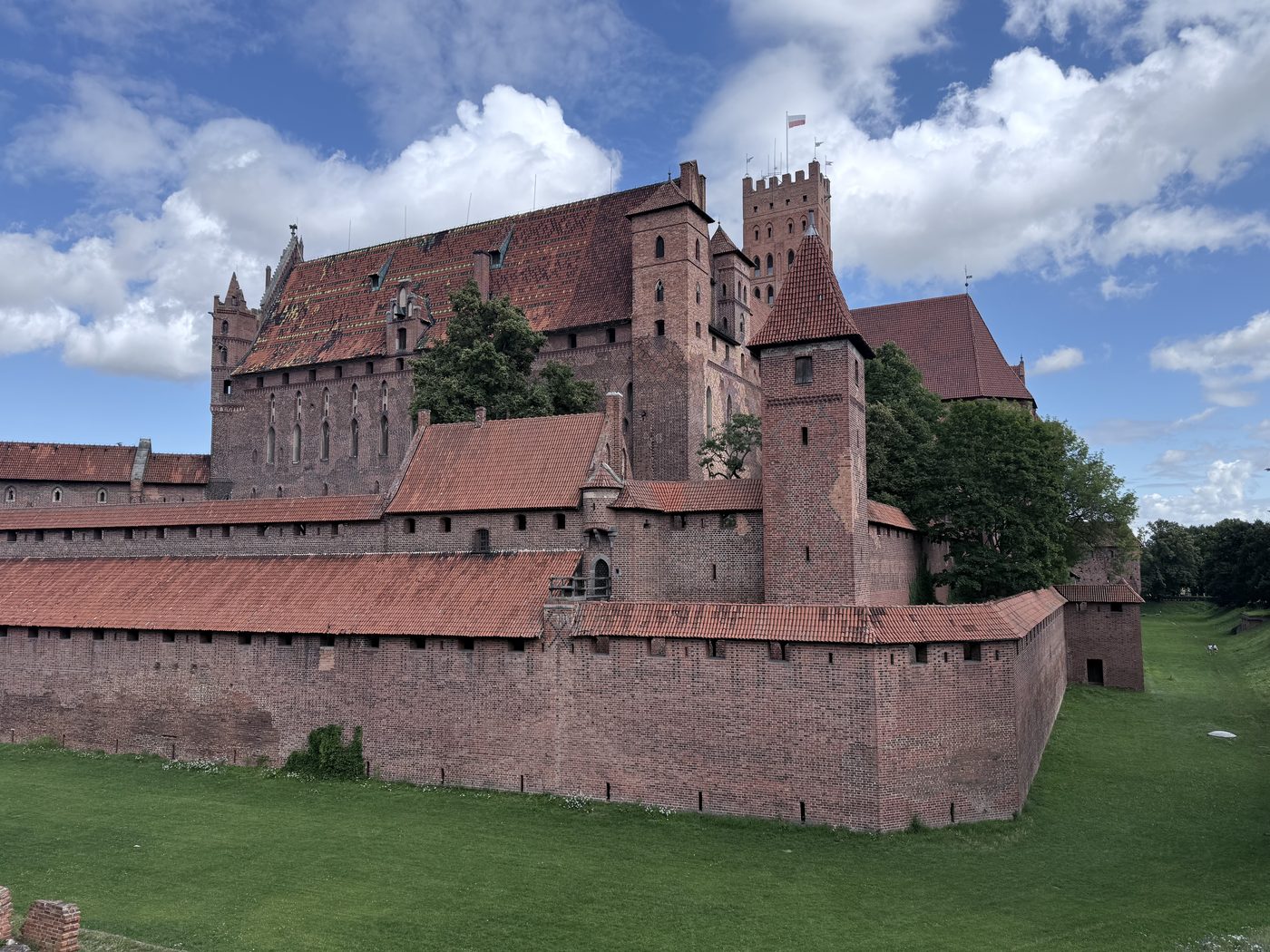 Malbork Castle in Poland, the world's largest brick castle, seen from across the moat