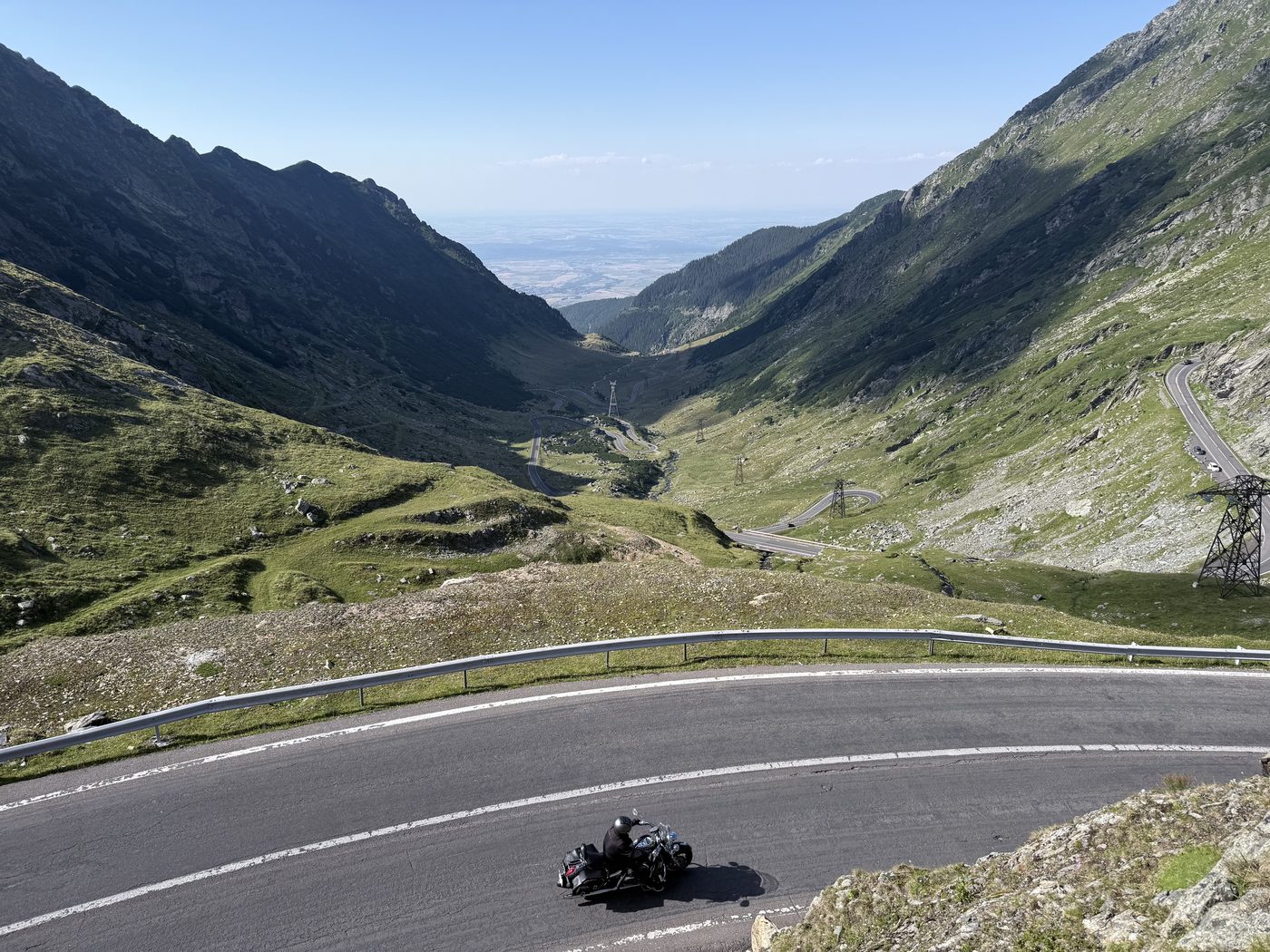 A motorcycle leaning into a hairpin bend high on the Transfăgărășan